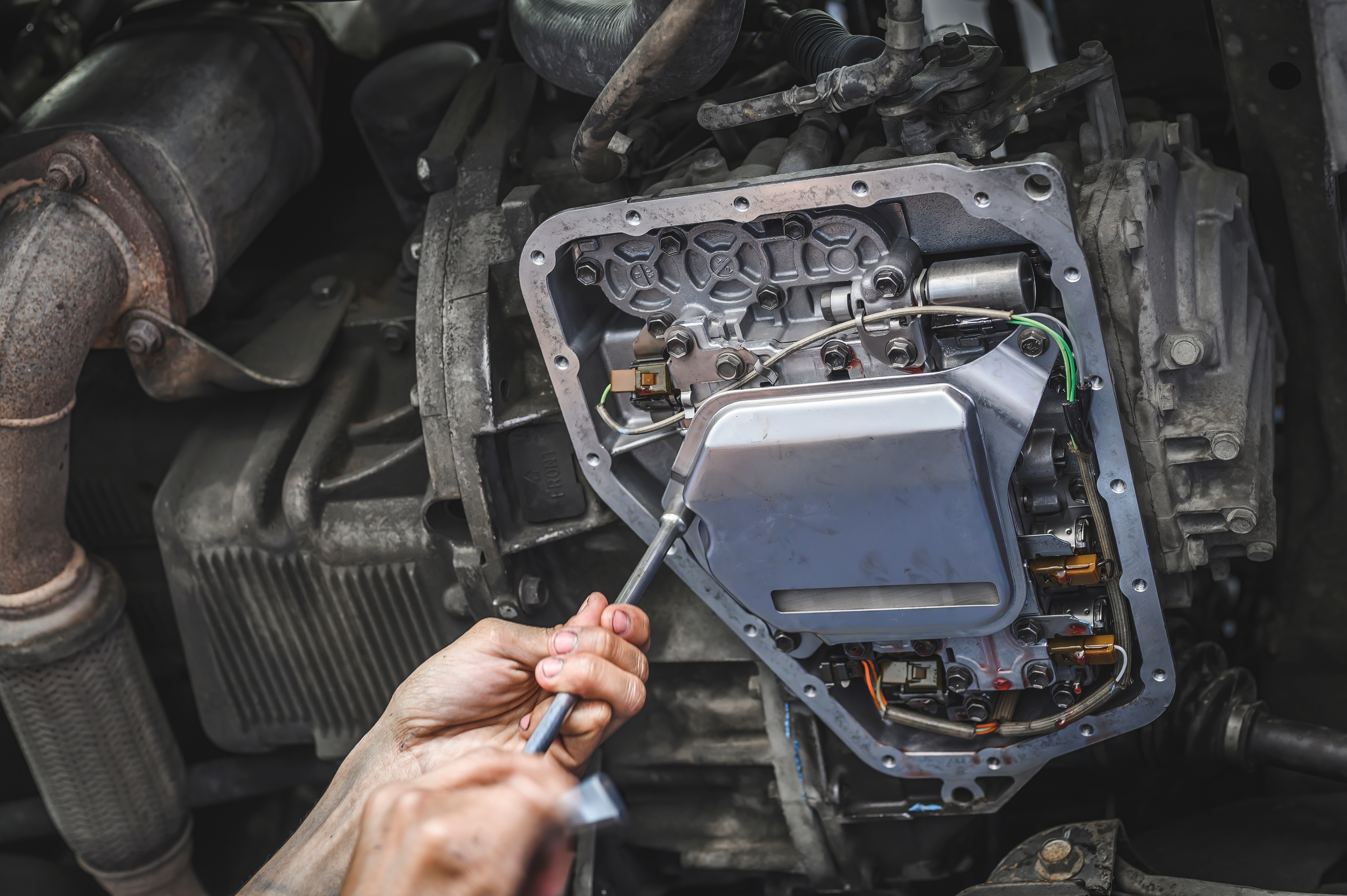 Technician working on driveline components